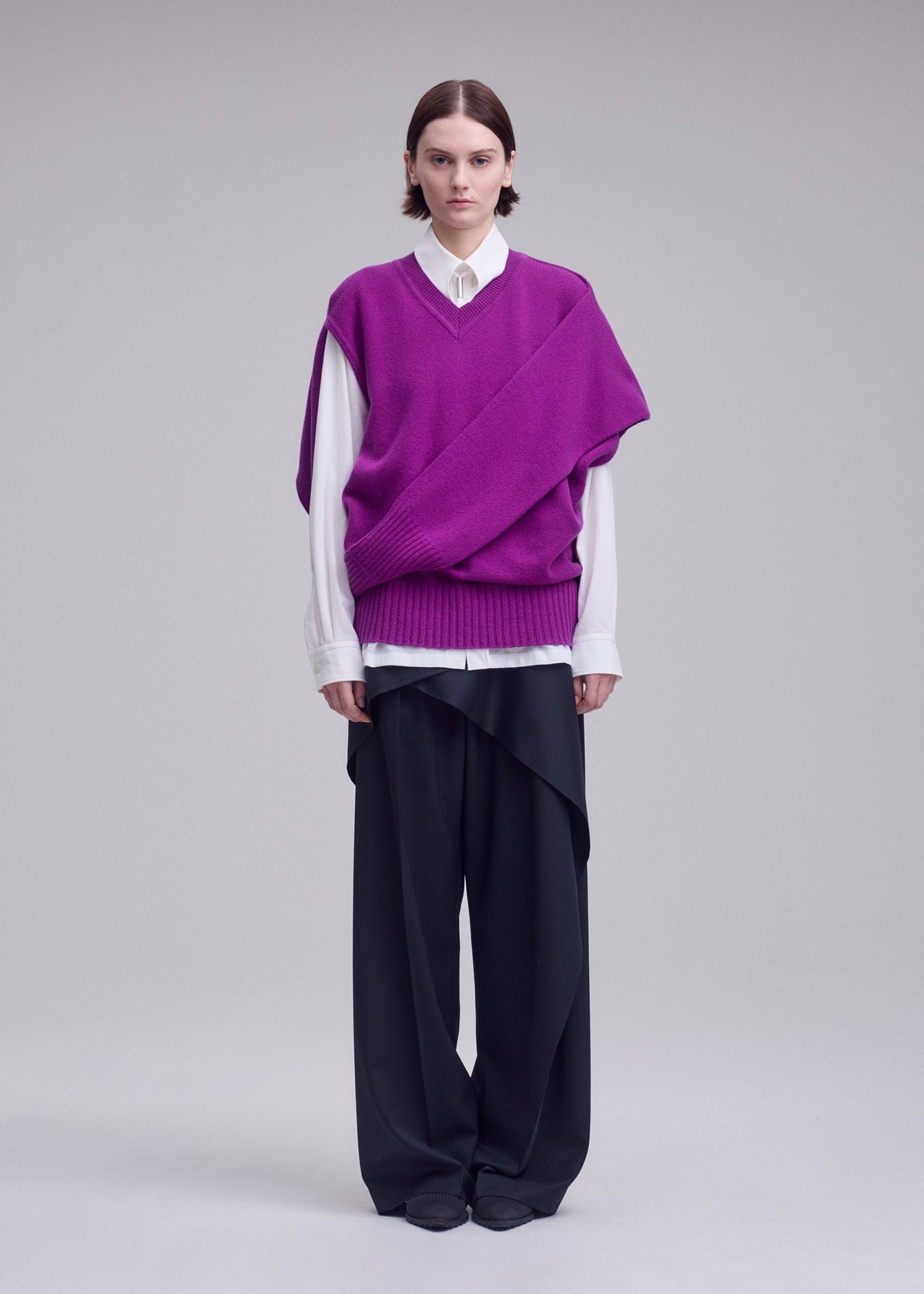 A model wears the ISSEY MIYAKE O KNIT o-knit-vest-off-white.