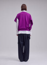 A model wears the ISSEY MIYAKE O KNIT o-knit-vest-purple.