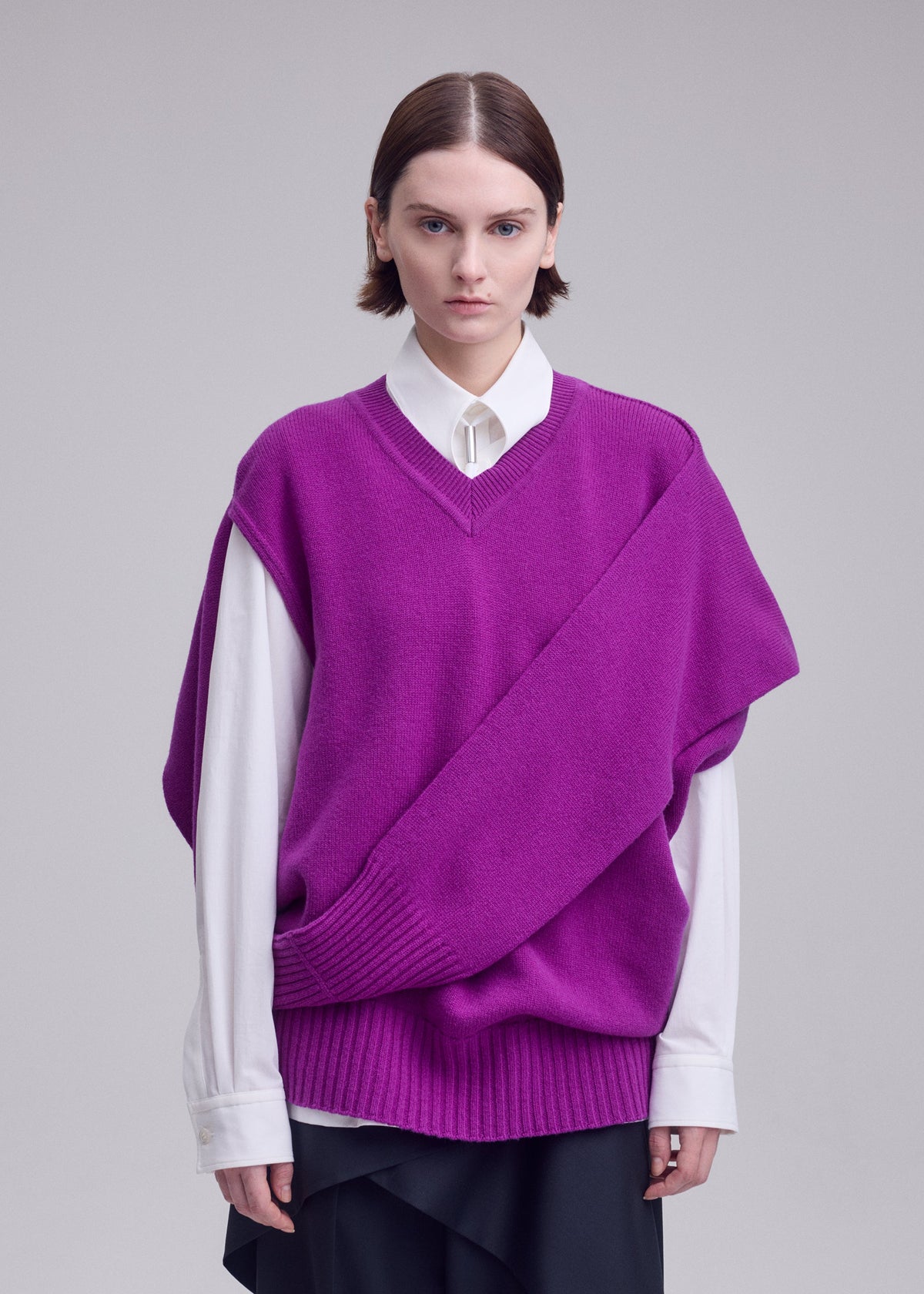 A model wears the ISSEY MIYAKE O KNIT o-knit-vest-off-white.