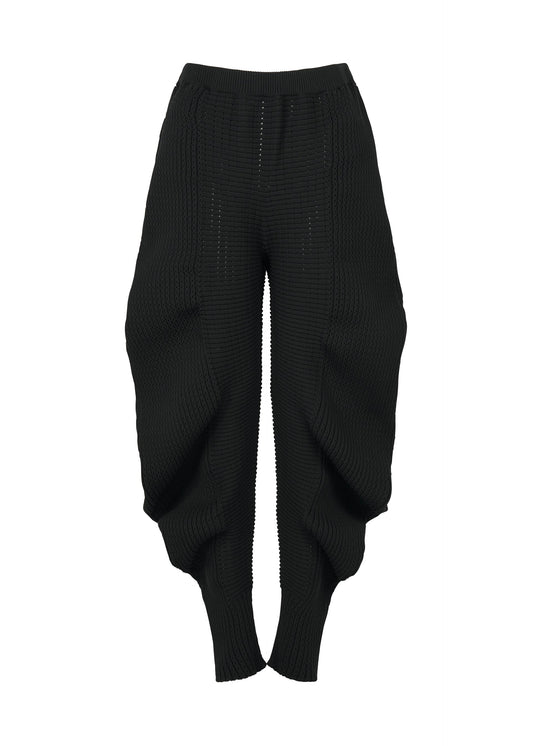 A product shot of the ISSEY MIYAKE FOUND STONE trousers in black.