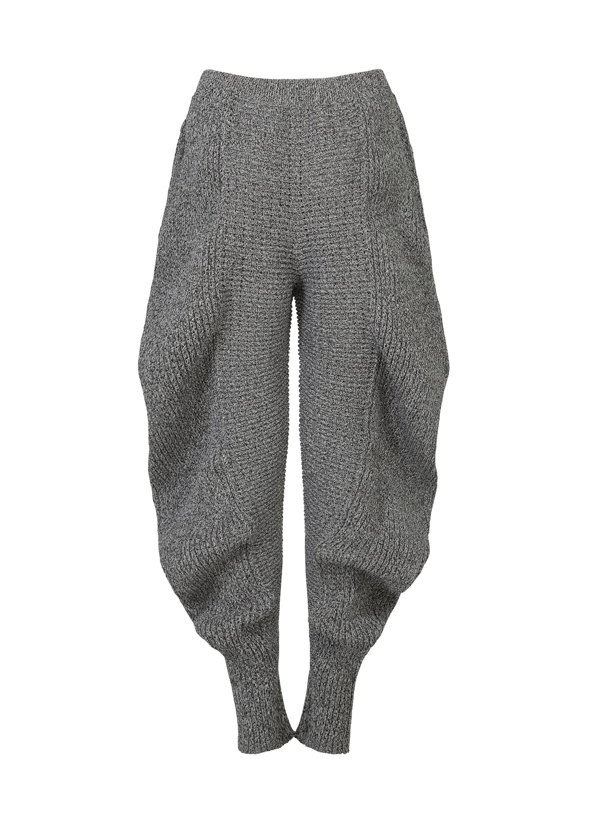 A detail shot of the ISSEY MIYAKE FOUND STONE trousers.