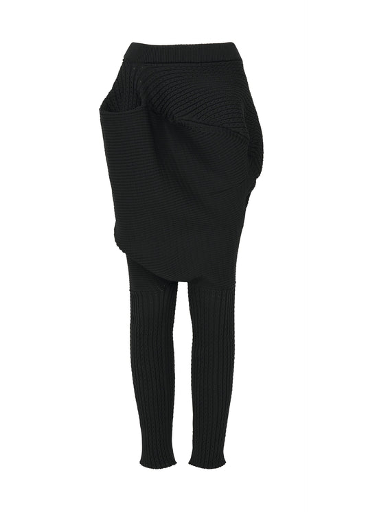 A product shot of the ISSEY MIYAKE FOUND STONE trousers in black.
