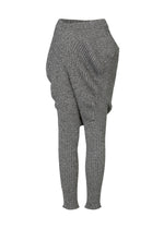A detail shot of the ISSEY MIYAKE FOUND STONE trousers.