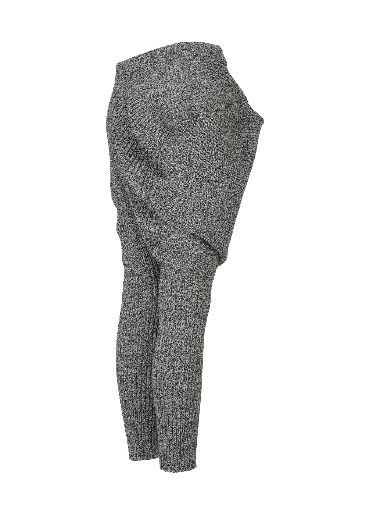 A detail shot of the ISSEY MIYAKE FOUND STONE trousers.