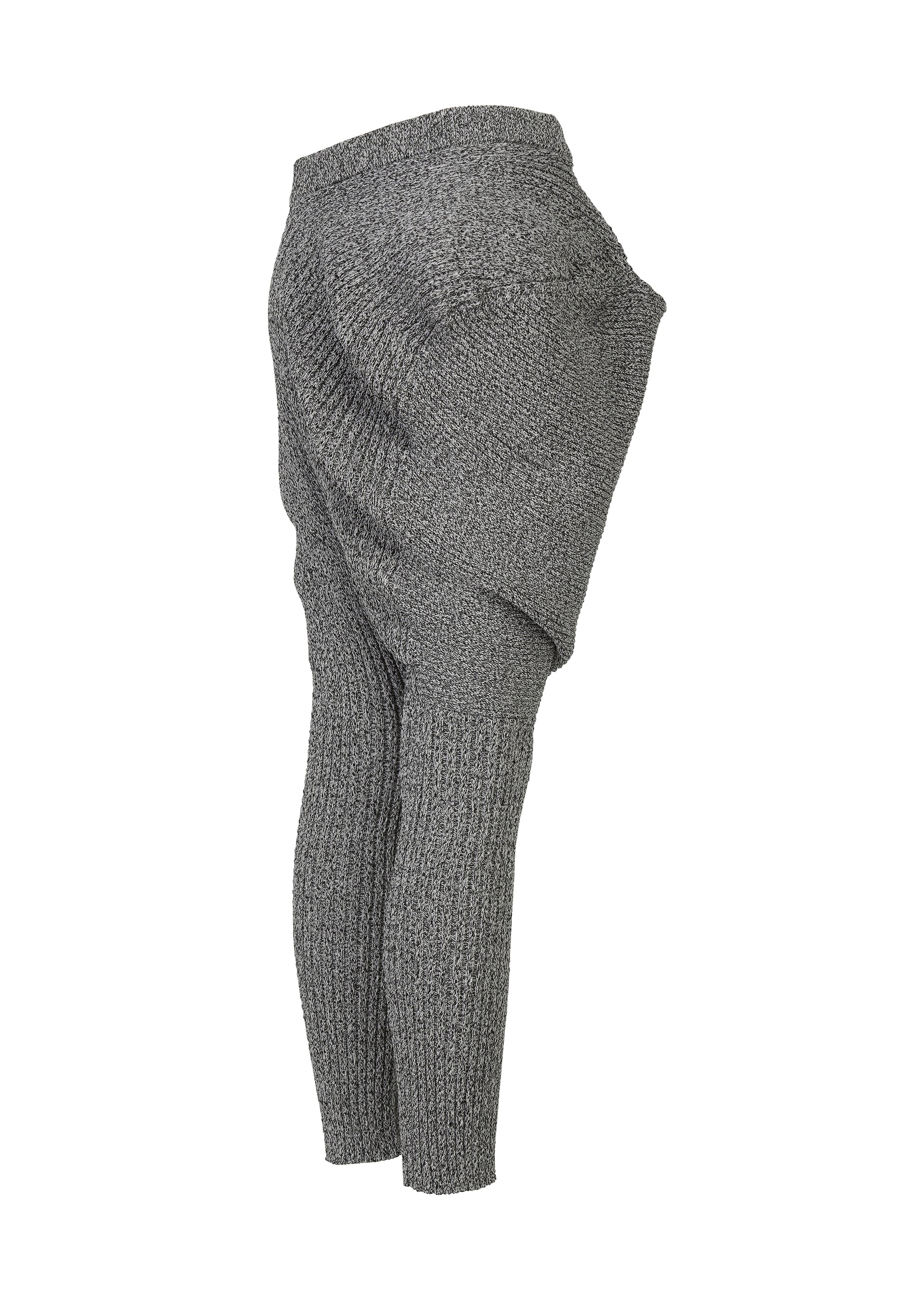 A detail shot of the ISSEY MIYAKE FOUND STONE trousers.