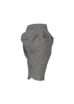 A detail shot of the ISSEY MIYAKE FOUND STONE skirt.