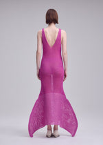 A model wears the ISSEY MIYAKE PANINI PULLED panini-pulled-dress-light-beige.
