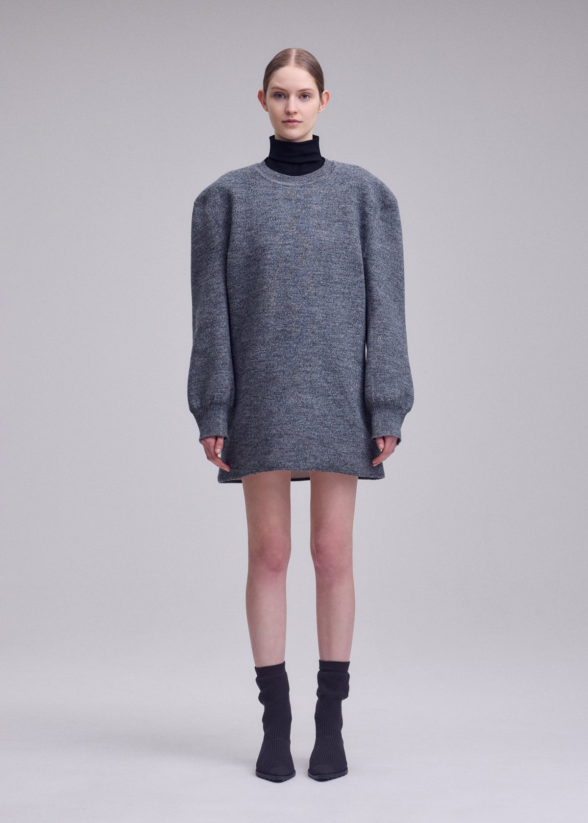 A model wears the ISSEY MIYAKE HANDSOME KNIT handsome-knit-dress-grey.