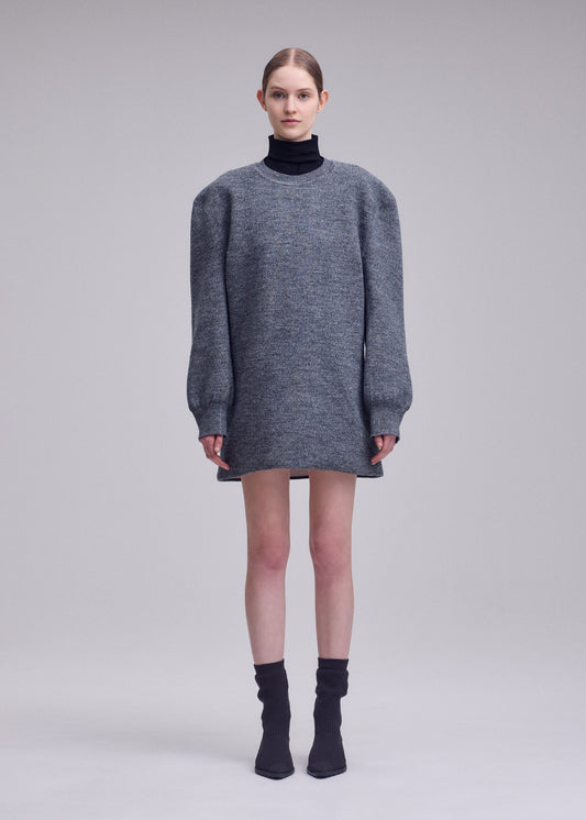 A model wears the ISSEY MIYAKE HANDSOME KNIT handsome-knit-dress-grey.
