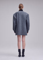 A model wears the ISSEY MIYAKE HANDSOME KNIT handsome-knit-dress-grey.