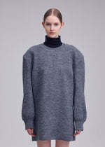 A model wears the ISSEY MIYAKE HANDSOME KNIT handsome-knit-dress-grey.