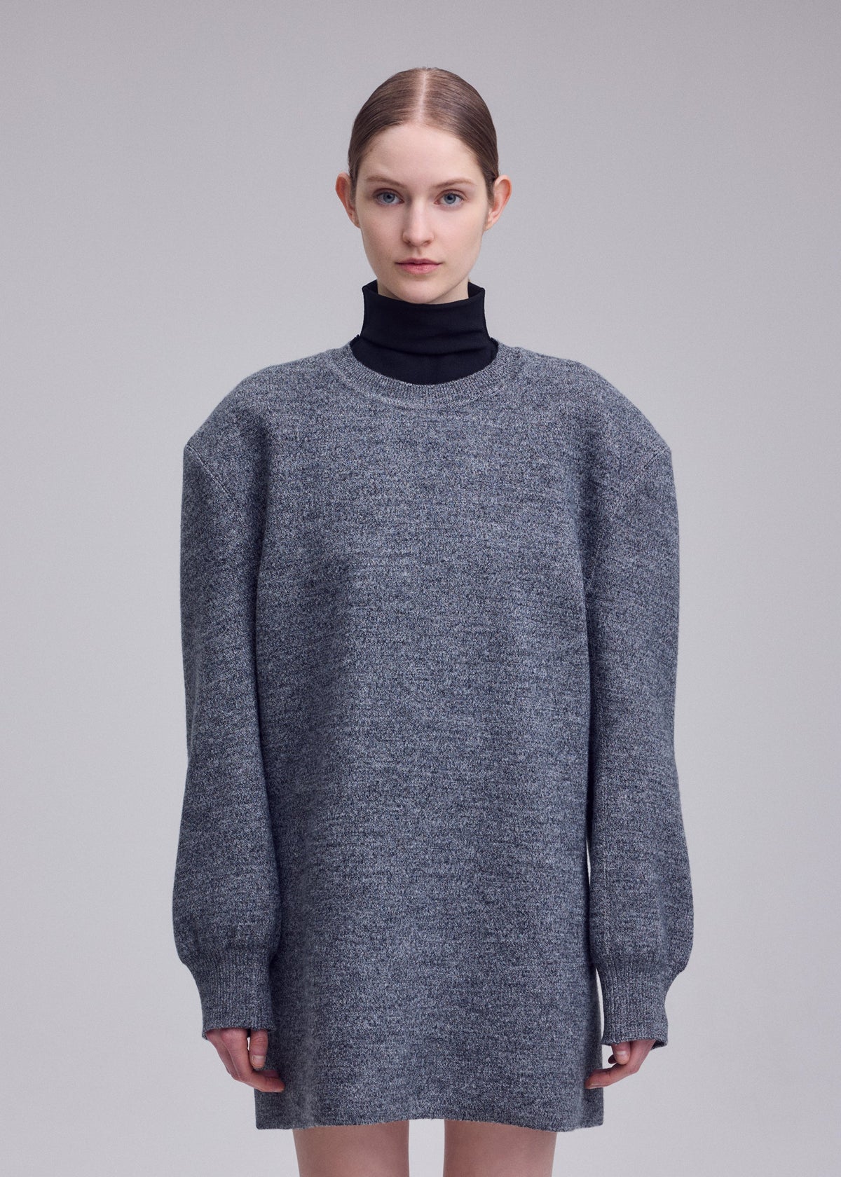 A model wears the ISSEY MIYAKE HANDSOME KNIT handsome-knit-dress-grey.