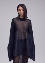 A model wears the ISSEY MIYAKE PANINI PULLED panini-pulled-top-black.