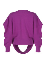 A detail shot of the ISSEY MIYAKE O KNIT top.