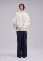A model wears the ISSEY MIYAKE O KNIT o-knit-high-neck-top-purple.
