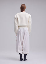 A model wears the ISSEY MIYAKE HANDSOME KNIT handsome-knit-top-black.