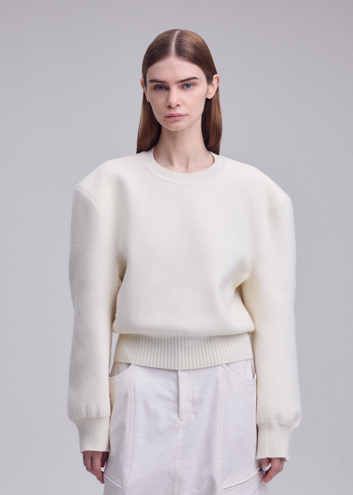 A model wears the ISSEY MIYAKE HANDSOME KNIT handsome-knit-top-black.