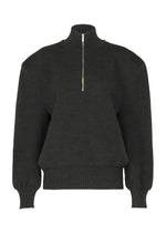 A product shot of the ISSEY MIYAKE HANDSOME KNIT top in black.