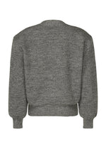 A detail shot of the ISSEY MIYAKE HANDSOME KNIT cardigan.