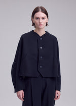 A model wears the ISSEY MIYAKE CAMPAGNE campagne-button-front-cardigan-dark-navy.