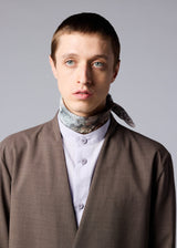 A model wears the IM MEN SOIL SCARF stole.