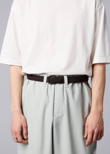 A model wears the IM MEN  STRETCH MESH BELT belt