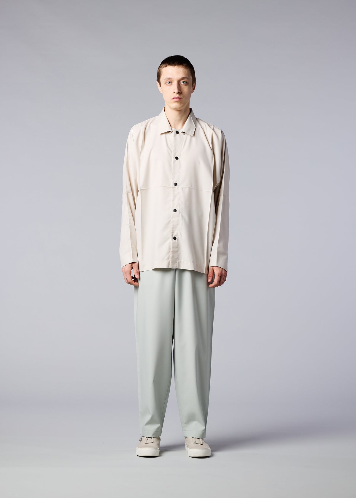 A model wears the IM MEN  FLAT trousers