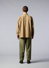 A model wears the IM MEN WOOL LIKE WINGS trousers.