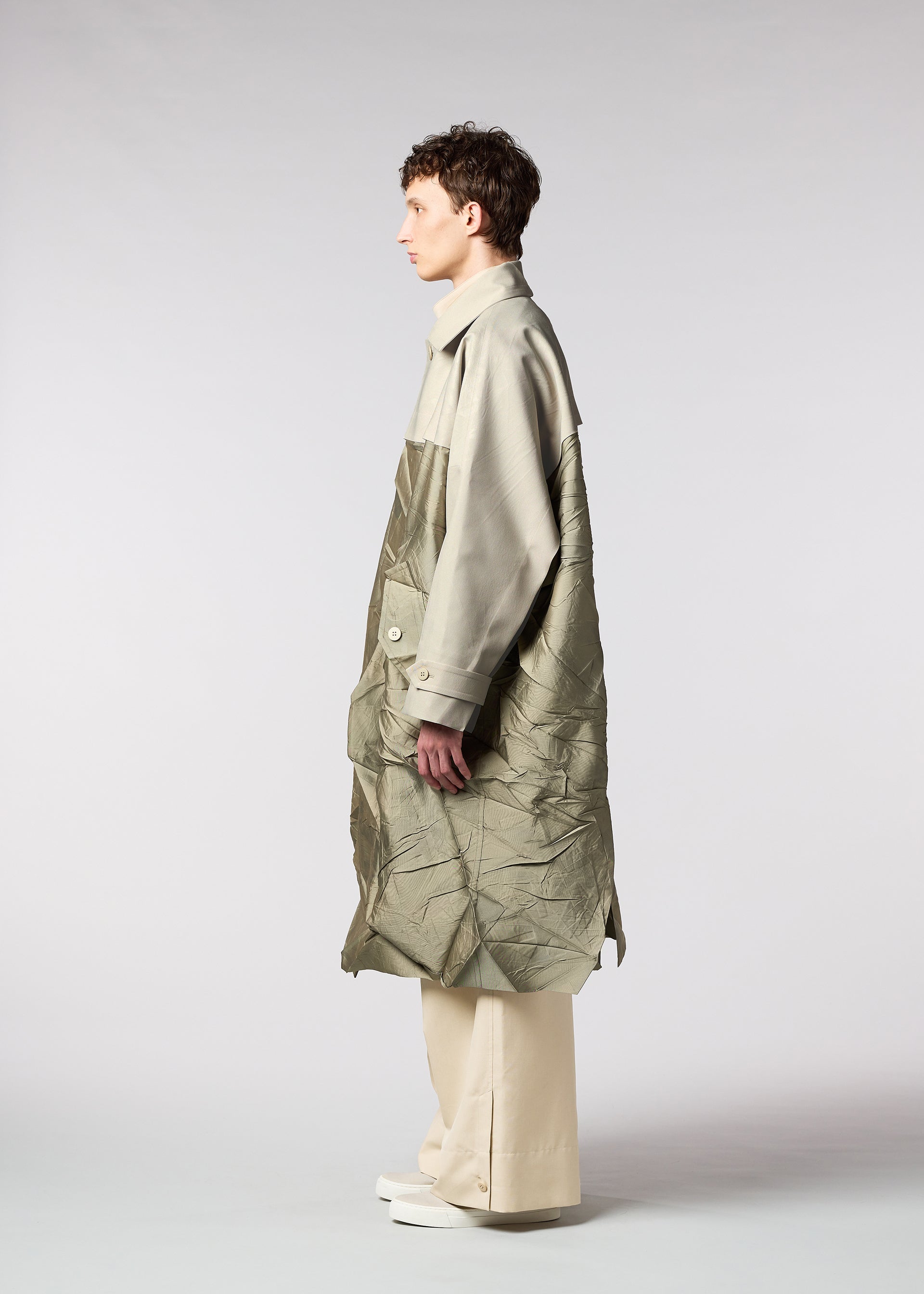 A model wears the IM MEN HIDING coat.