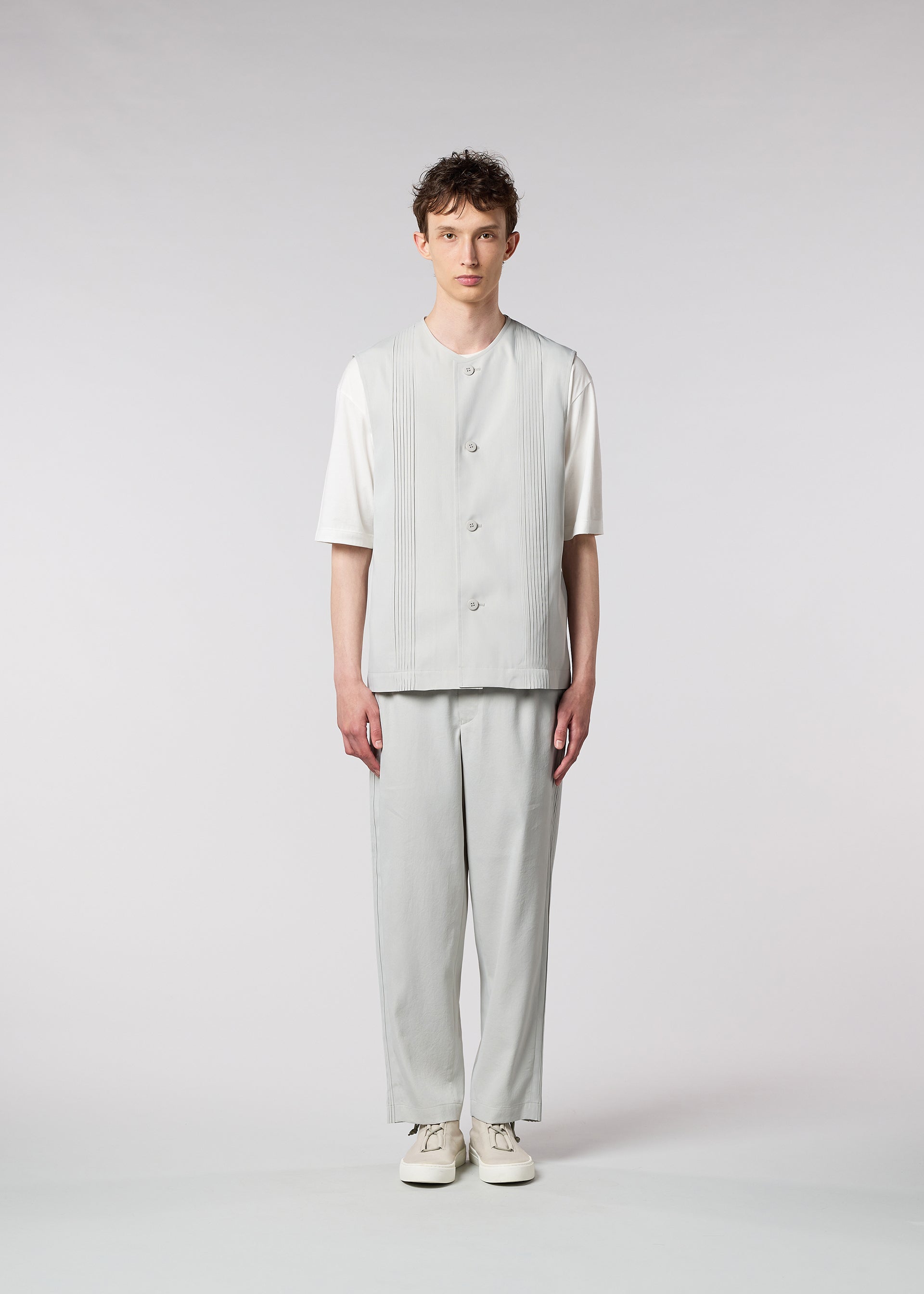 A model wears the IM MEN AIR PLEATS vest.