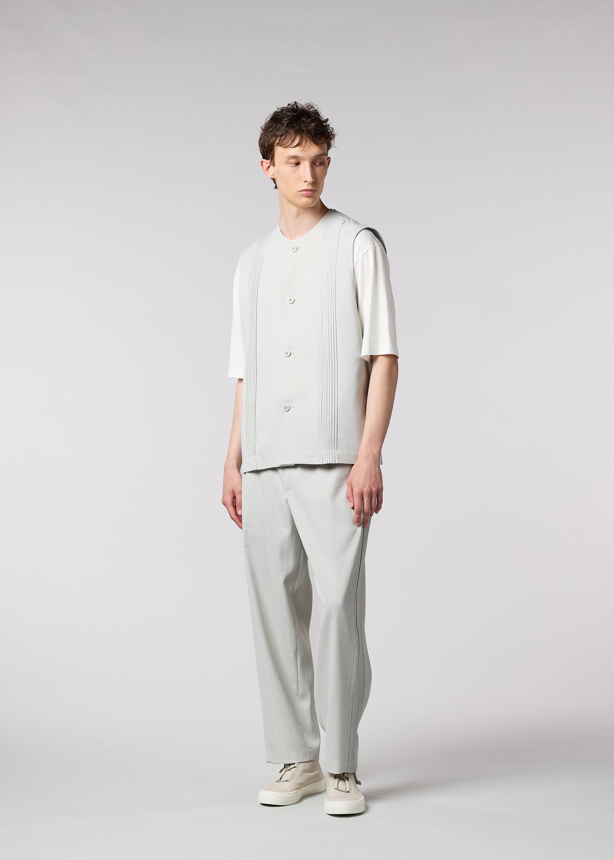 A model wears the IM MEN AIR PLEATS vest.