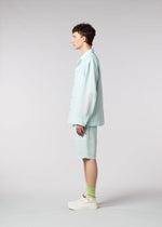 A model wears the IM MEN LUCID trousers.