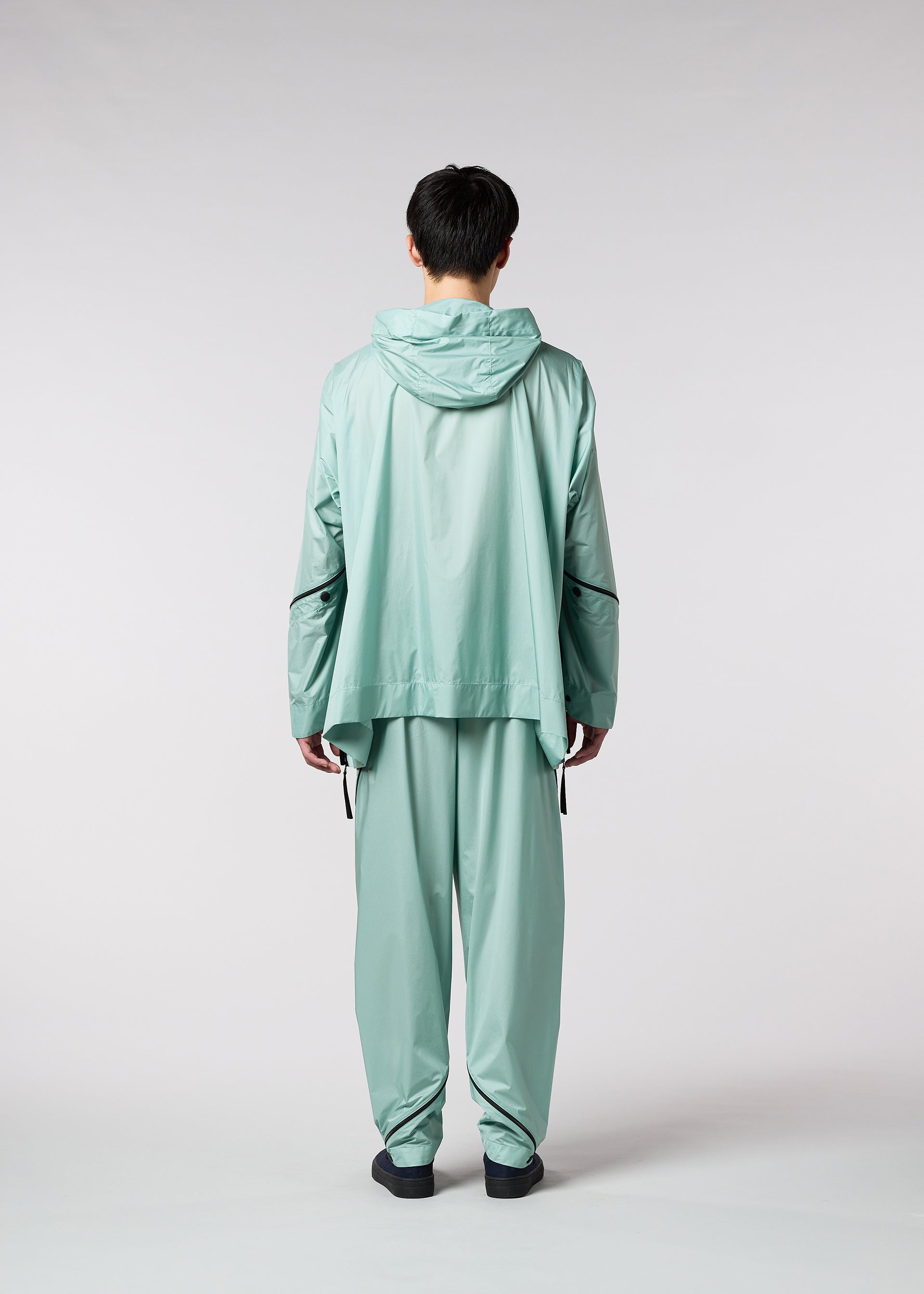 A model wears the IM MEN WIND trousers.