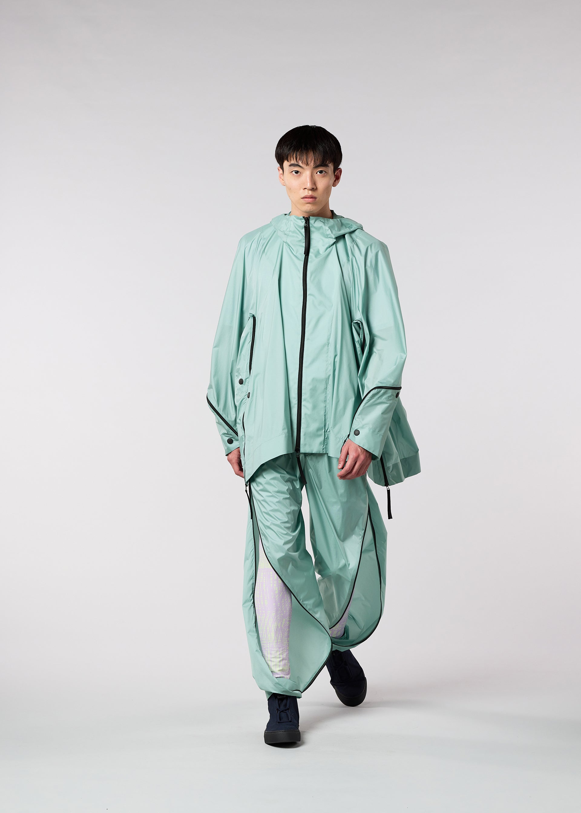 A model wears the IM MEN WIND trousers.