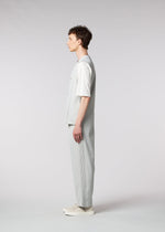 A model wears the IM MEN AIR PLEATS trousers.
