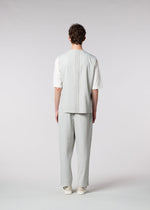 A model wears the IM MEN AIR PLEATS trousers.