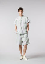 A model wears the ISSEY MIYAKE MEN SCENES trousers.