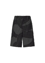 A product shot of the ISSEY MIYAKE MEN SCENES trousers in black (15).