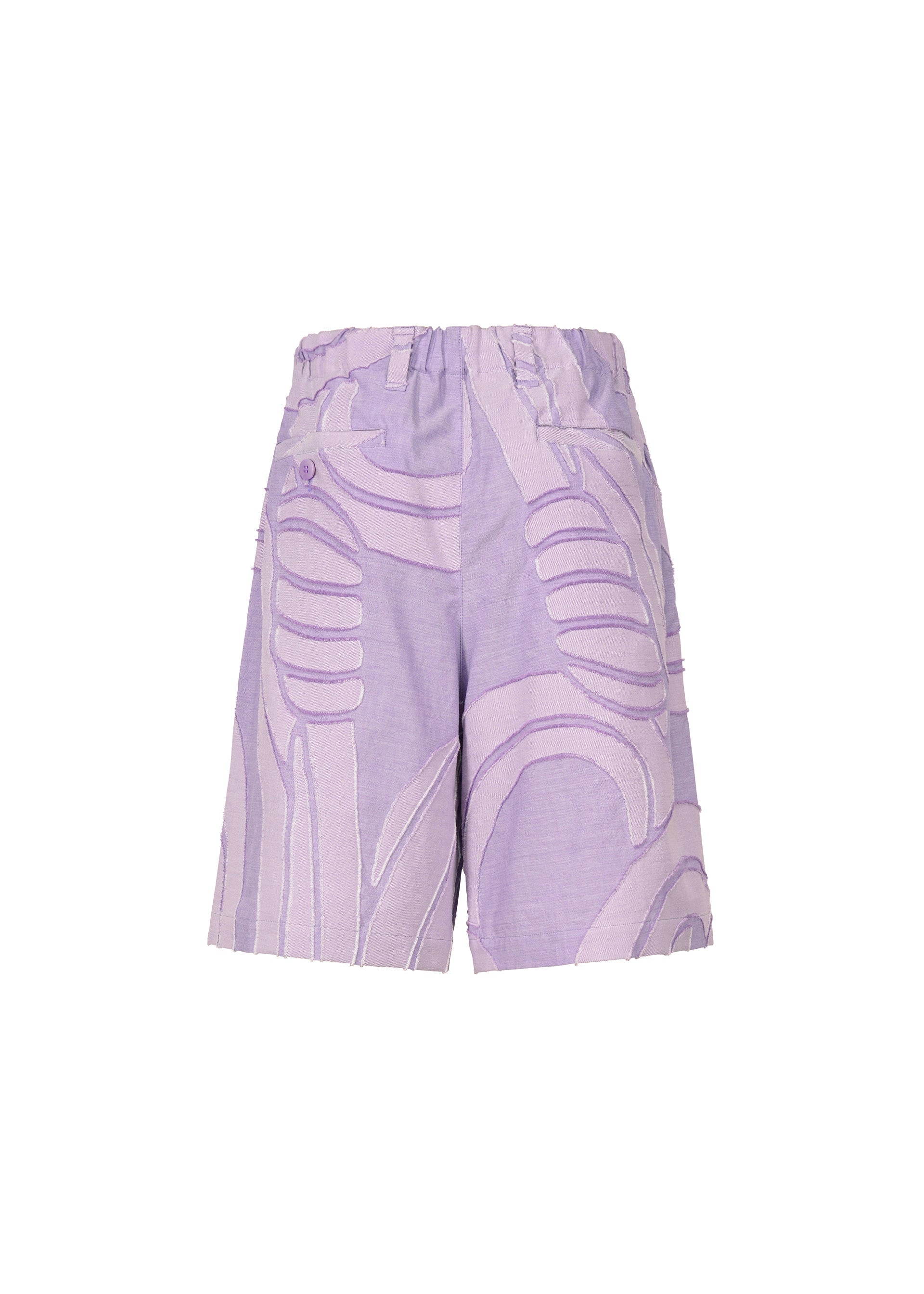 A detail shot of the ISSEY MIYAKE MEN SCENES trousers.