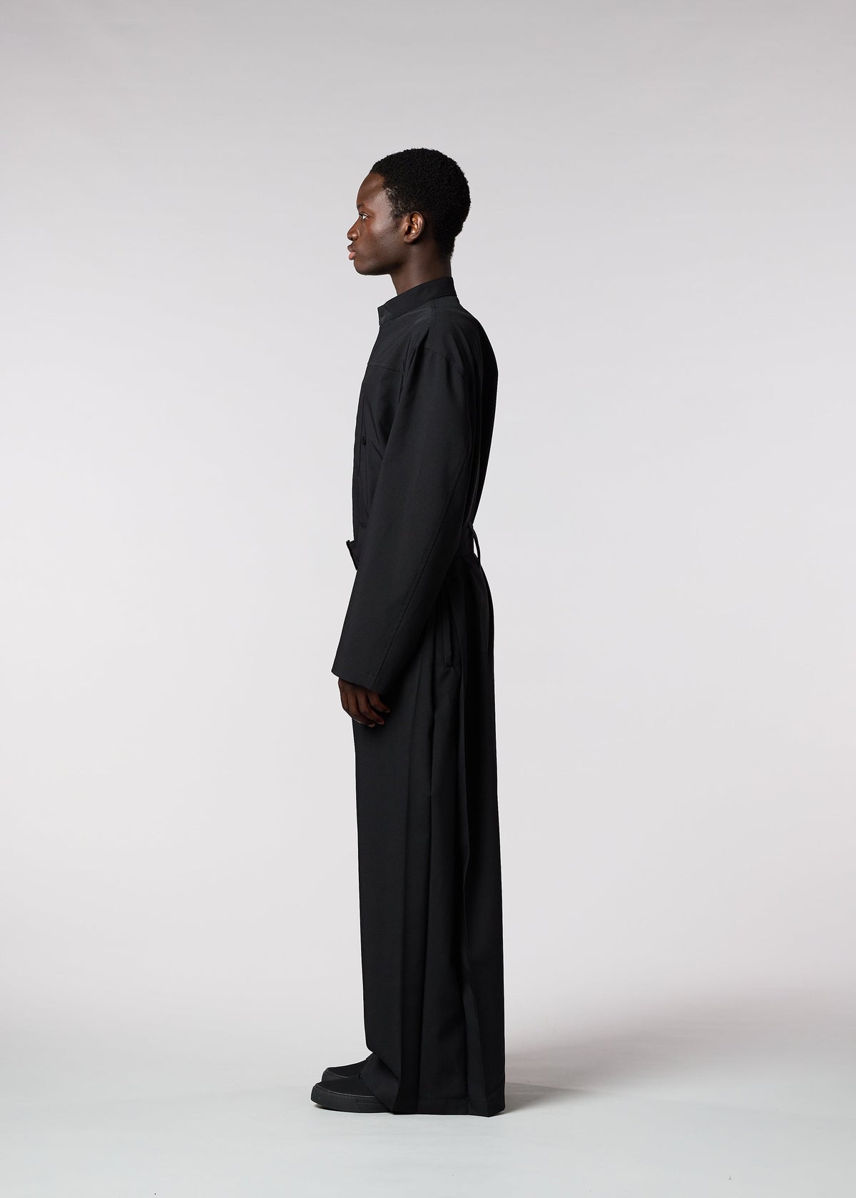 A model wears the ISSEY MIYAKE MEN WINGS jumpsuit.