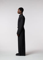 A model wears the ISSEY MIYAKE MEN WINGS jumpsuit.