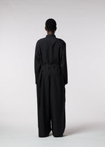 A model wears the ISSEY MIYAKE MEN WINGS jumpsuit.