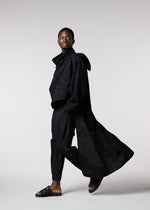 A model wears the IM MEN KASURI shirt.