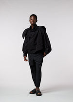 A model wears the IM MEN KASURI shirt.