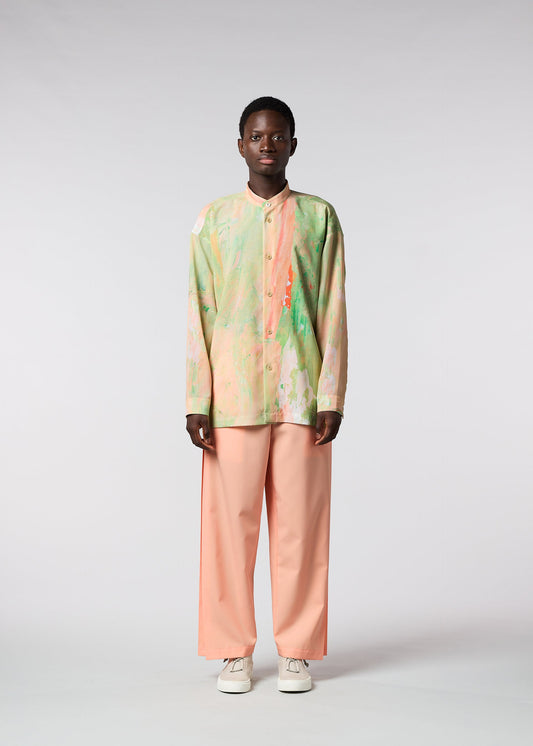 A model wears the ISSEY MIYAKE MEN BY CHANCE shirt.