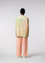 A model wears the ISSEY MIYAKE MEN BY CHANCE shirt.