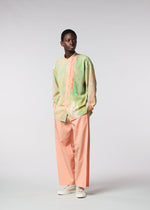 A model wears the ISSEY MIYAKE MEN BY CHANCE shirt.