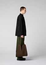 A model wears the IM MEN PATA PATA bag.