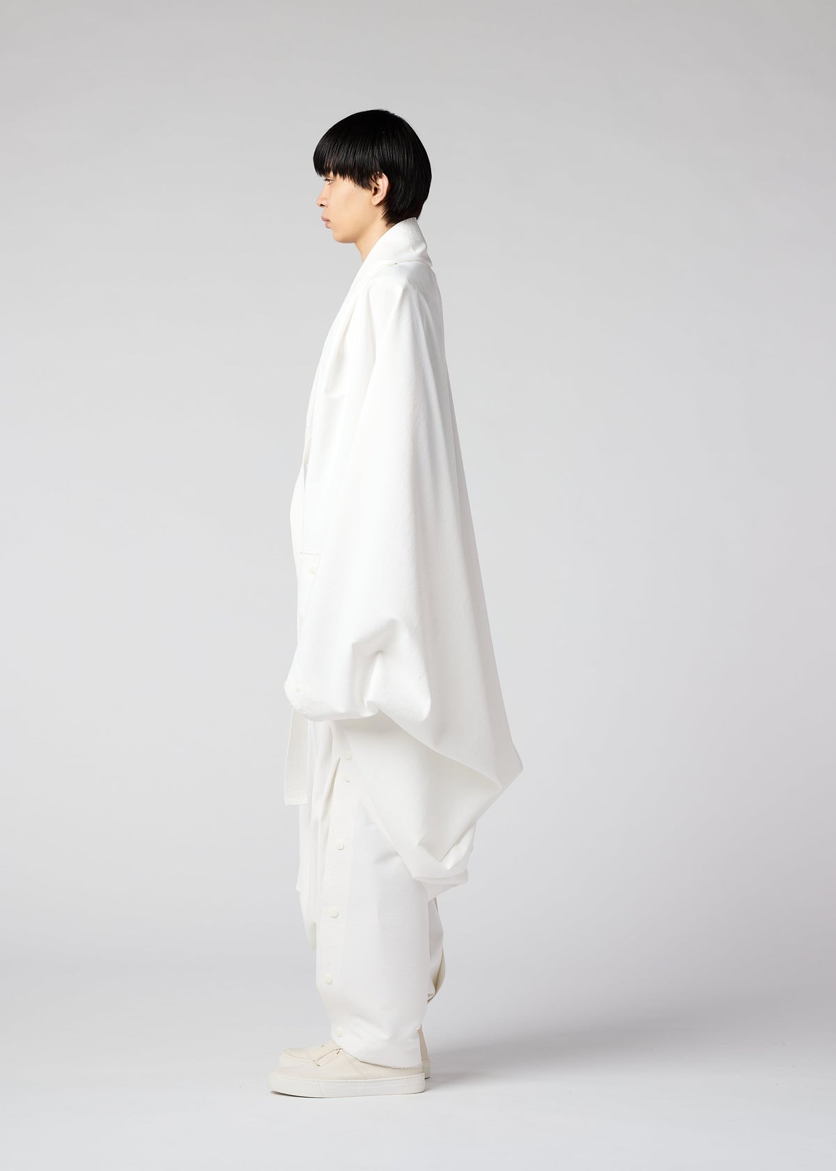 A model wears the IM MEN FLY coat.