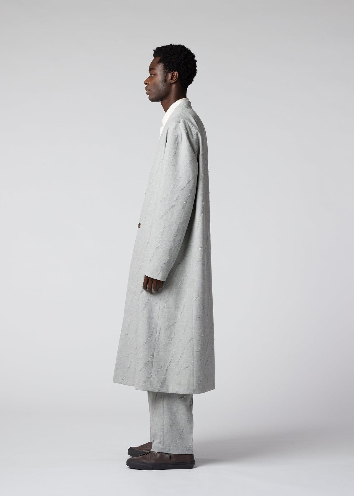 A model wears the IM MEN FLY WOOL coat.